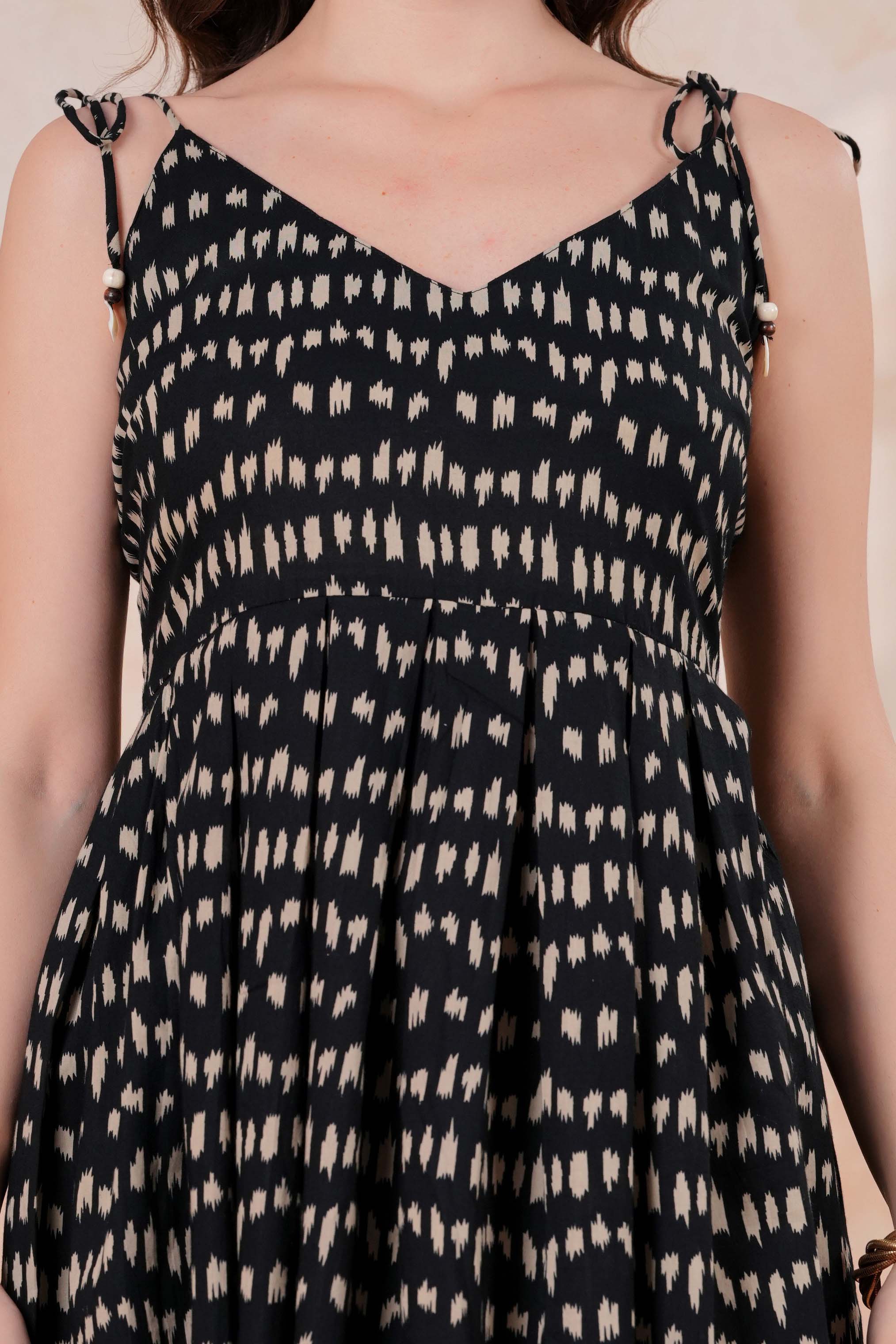 Printed Sleeveless Flared Peplum Top with Tie-Up Straps